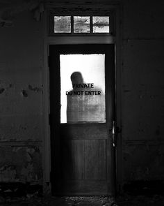 an open door with the words private don't enter on it in black and white