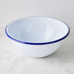 a white and blue bowl sitting on top of a table