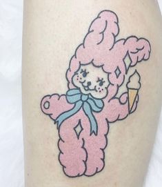 a pink teddy bear with an ice cream cone on its back leg, is shown