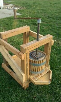 an old fashioned water pump sitting in the grass