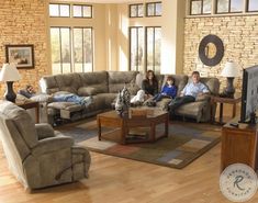 a family sitting on the couch in their living room