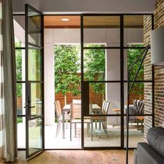 an open living room and dining area with sliding glass doors