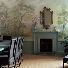 a dining room table with chairs and a mirror on the wall next to a fireplace