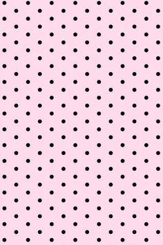 a pink background with black polka dots