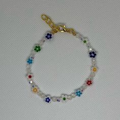 Handmade 7 In Gold Wire Bracelet With A 1 In Extender Featuring White Multi-Color Flower And Small White Crystal Beads! Color Flower, Wire Bracelet, Handmade Gold, Gold Wire, White Crystal, Jewelry Handmade, Womens Jewelry Bracelets, Crystal Beads, Handmade Jewelry