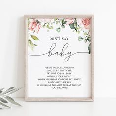 a framed print with the words don't say baby on it and pink roses