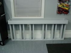 a white radiator sitting next to a window