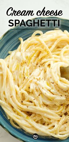 a blue bowl filled with cream cheese spaghetti