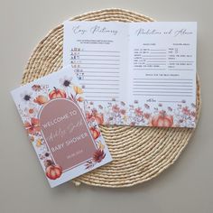 two wedding stationery cards sitting on top of a wicker plate