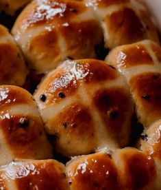 hot cross buns in a white baking dish