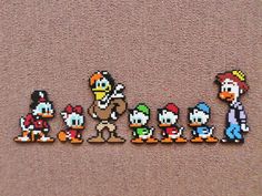 an image of some pixelated video game characters on the ground with their heads turned to look like they're from super mario and luigi