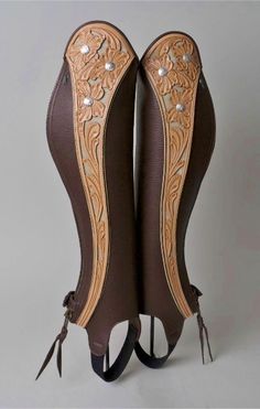 an image of two boots that are made out of leather and have pearls on them