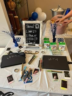 the table is set up with various items and decorations for an anniversary party or celebration