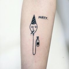 a black and white photo of a person's arm with a party tattoo on it