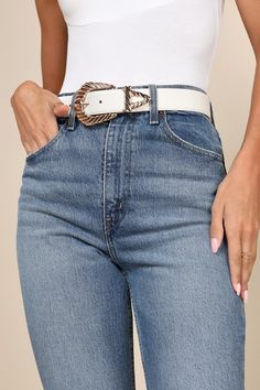 Say ""howdy"" to the endless array of iconic ways to style the Petit Moments Modern Rodeo White Western Belt! This cute belt is ready to giddy-up with its faux leather construction that shapes a Western-inspired silhouette with a shiny, oversized gold buckle with a twisted design and a matching tip. Pair to perfection with all of your favorite blue denim! Size XS/S Measures 1. 25" Wide. Belt Adjusts Between 28" And 34" With 7 Hole Adjustments. Size M/L Measures 1. 25" Wide. Belt Adjusts Between Adjustable Belt With Buckle Closure For Fall, Trendy Adjustable Belts For Spring, Trendy Adjustable Belt For Spring, Chic White Belt For Spring, Trendy Adjustable Belts, Adjustable Spring Belt With Buckle, Trendy Fall Belt Buckles, Trendy Belt Buckles For Fall, Casual Belts With Buckle Closure For Spring