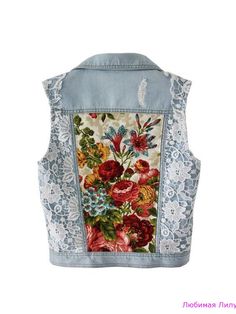 a women's jean jacket with flowers and lace on the back, in light blue