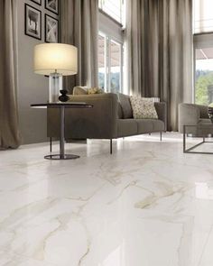 a living room with white marble floors and furniture