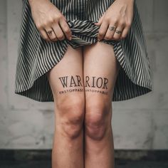 two women with tattoos on their legs that say warrior