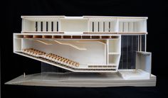 a model of a building with lots of shelves on it's front and sides