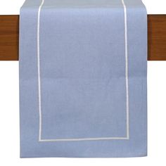 a light blue table runner with white trim on it and a wooden frame around the edge