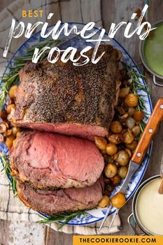 the best prime rib roast recipe with potatoes, carrots and other vegetables on a plate