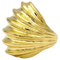 Ring Size: 5.25 This gorgeous Ilias Lalaounis shell design ridged wrap ring, crafted in 22 karat yellow gold, is a stunning piece of jewelry that captures the essence of nature's beauty. Inspired by the intricate patterns and textures of seashells, this exquisite ring features a unique wrap-around design adorned with intricate ridges reminiscent of the natural ridges found on seashells. The rich 22 karat yellow gold adds a luxurious touch to the ring, enhancing its beauty and elegance. The wrap- Shell Design, Wrap Ring, Wrap Rings, Cocktail Ring, Intricate Patterns, Cocktail Rings, Nature Beauty, Yellow Gold Rings, Sea Shells