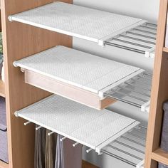 an open closet with shelves and drawers