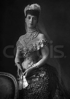 an old black and white photo of a woman in a wedding dress with tiara