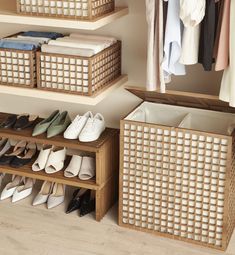 an organized closet with baskets and shoes