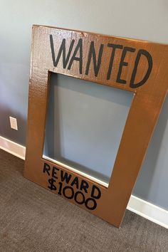 a wooden frame that says wanted reward $ 1, 000