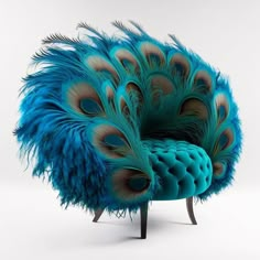 a blue peacock chair with feathers on it's back and legs, in front of a white background