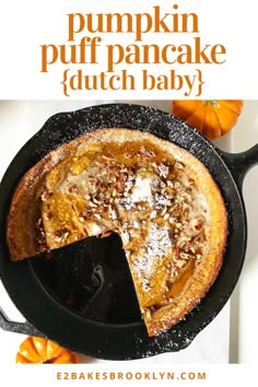 pumpkin puff pancake dutch baby in a cast iron skillet with a slice cut out