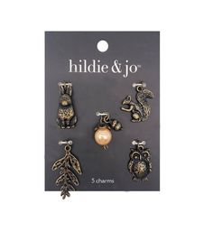 an assortment of charms in gold and silver with the words'hide & jo '