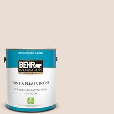 a can of behr premium plus paint and primer in one on a blue background