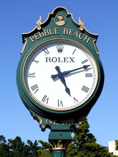 a large clock with roman numerals on the side of it's face