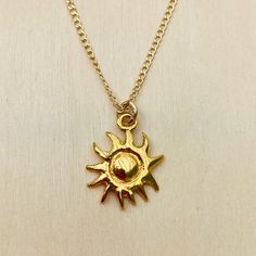 You’re My Sunshine - Sun Charm Necklace. Inspired by the brightness, beauty and warmth of our most natural source of Vitamin D, this pretty SUN charm is meant to bring you days filled with Sunny Rays. Lexi Jewelry exclusive design Handcrafted in USA. Sun charm is gold plated bronze measures approx 1/2” wide x 5/8” tall. 14Kt gold filled chain 16” long. Sun-shaped Necklace For Summer Gifts, Gold Sun-shaped Necklace Gift, Gold Sun-shaped Necklace As A Gift, Gold Sun-shaped Necklace For Gift, Everyday Yellow Gold Sun Design Jewelry, Everyday Yellow Gold Jewelry With Sun Design, Gold Sun-shaped Jewelry For Everyday, Bohemian Sun-shaped Gold Jewelry, Everyday Sun-shaped Jewelry With Sun Design