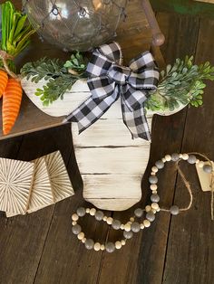 carrots, broccoli and other vegetables are arranged on a wooden table