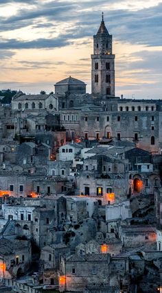 an old city is lit up at night