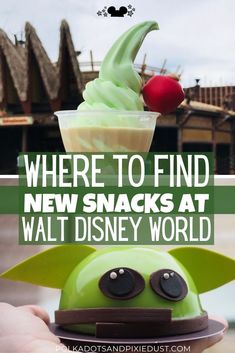 a hand holding up a toy with the words where to find new snacks at walt world