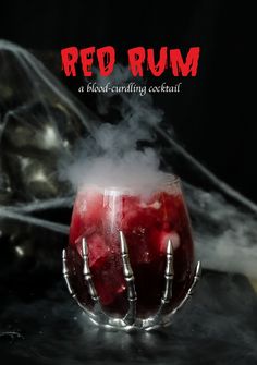 a red rum cocktail in a glass with steam coming out of it and the words, red rum