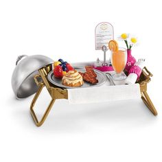 a small table with food and drinks on it