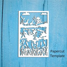 a paper cut out of water and reeds on a blue background with the words papercut template