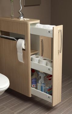 a bathroom cabinet with the door open and toilet paper in it's drawer next to a sink