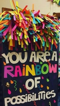 there is a sign that says you are a rainbow of possibilities and confetti