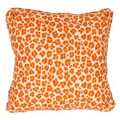 an orange and white leopard print pillow