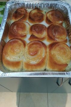 a pan filled with rolls sitting on top of a counter