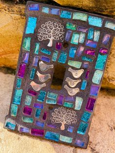 a decorative piece made out of glass and metal