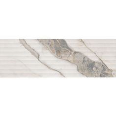 a white marble tile wall with wavy lines