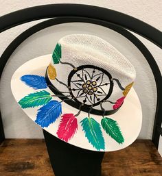 One of my favorites! Hat is sized medium but is lined with elastic so it fits most everyone! Multicolor Bohemian Straw Hat For Kentucky Derby, Bohemian Multicolor Straw Hat For Kentucky Derby, Artisan Fedora For Spring Vacation, Adjustable Hand Painted Fedora With Curved Brim, Adjustable Wide Brim Hand Painted Hats, Artistic Panama Hat With Adjustable Flat Brim, Handmade Panama Hat For Kentucky Derby, Handmade Summer Panama Hat For Kentucky Derby, Hand Painted Hat With Short Brim