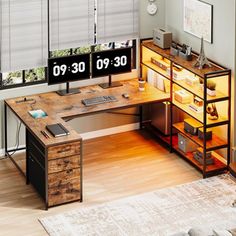 a computer desk with two monitors and a keyboard on it in front of a window